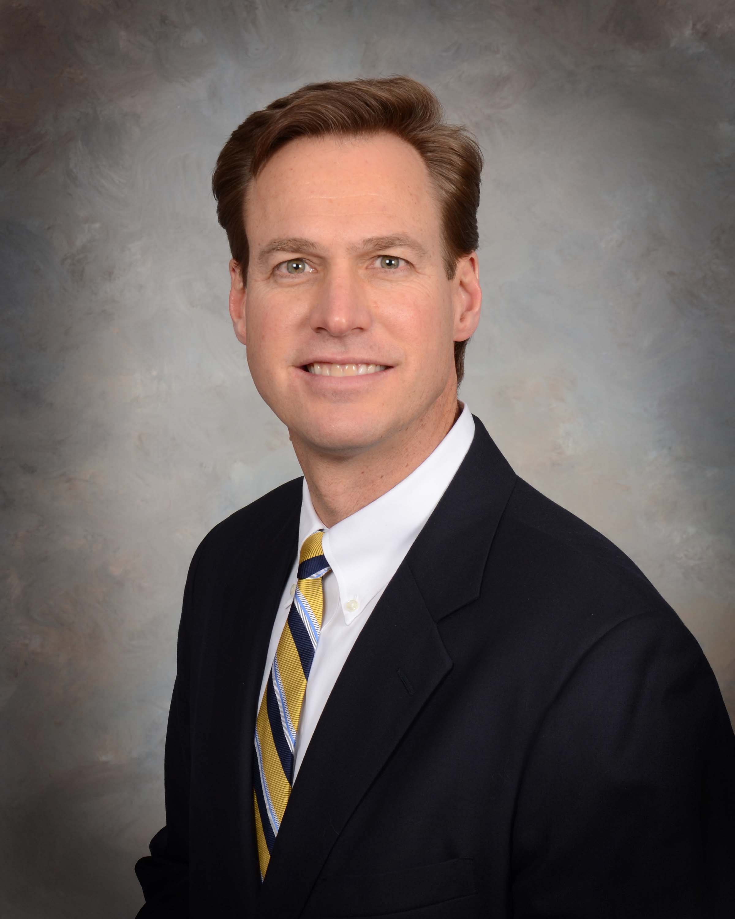 Dr. Kraft Smiling in a Formal Portrait Style Photo